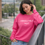 Woman wearing a pink sweatshirt with 'ABSOLUTELY NOT.' text, standing outdoors.