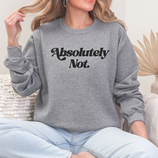 Person wearing a gray sweatshirt with 'Absolutely Not.' text, sitting on a couch.