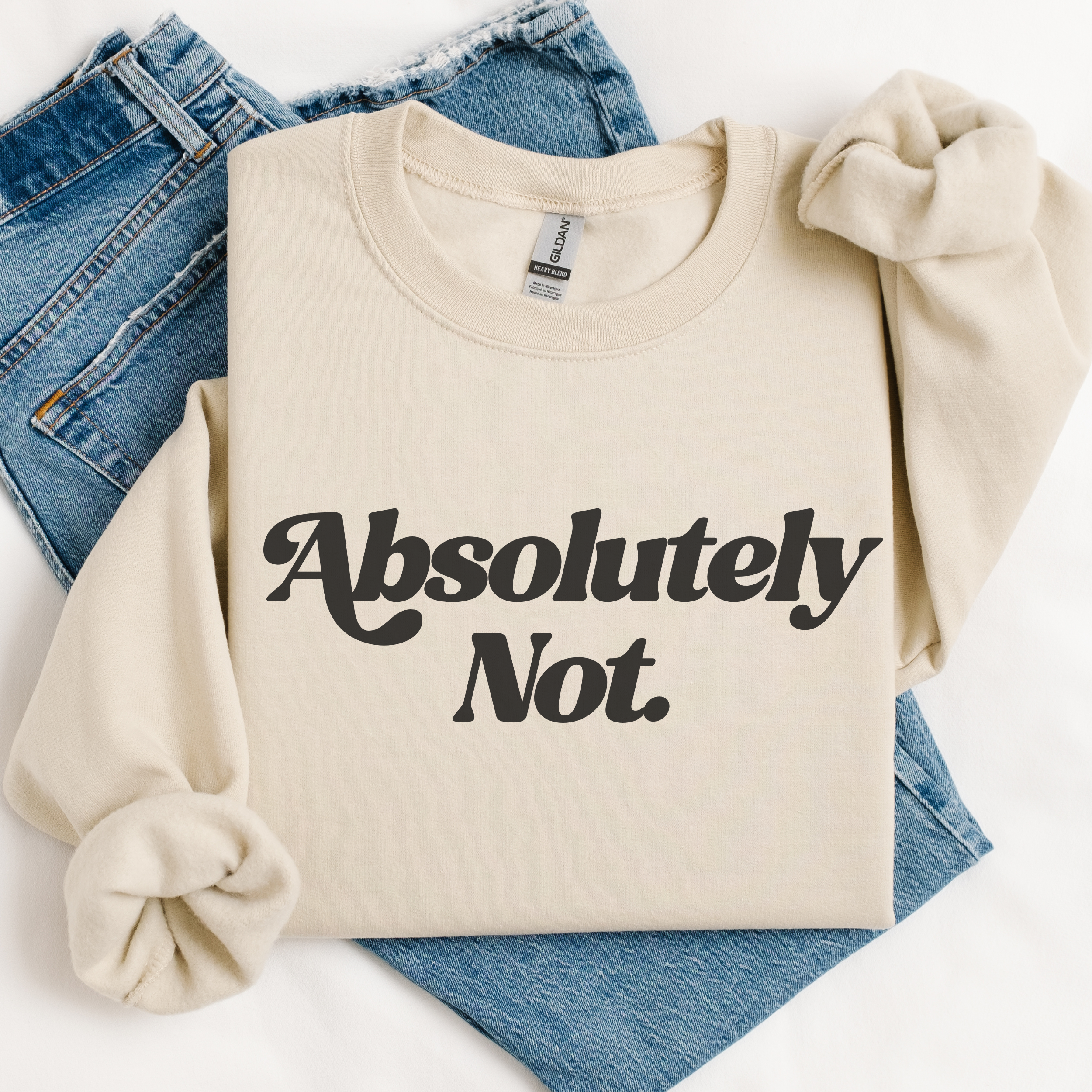 Beige sweatshirt with 'Absolutely Not' text on a white background