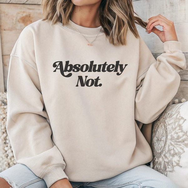 Person wearing a beige sweatshirt with 'Absolutely Not.' text.