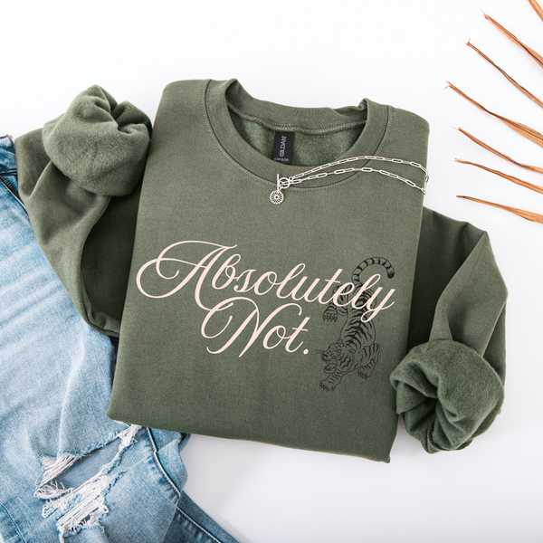 An olive green crewneck sweatshirt with rolled sleeves, featuring the text 'Absolutely Not.' in white script and a black tiger graphic.