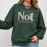 A woman wearing a dark green crewneck sweatshirt with a graphic print that reads 'ABSOLUTELY Not.' in white, with pink double horizontal lines underneath.