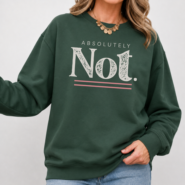 A woman wearing a dark green crewneck sweatshirt with a graphic print that reads 'ABSOLUTELY Not.' in white, with pink double horizontal lines underneath.