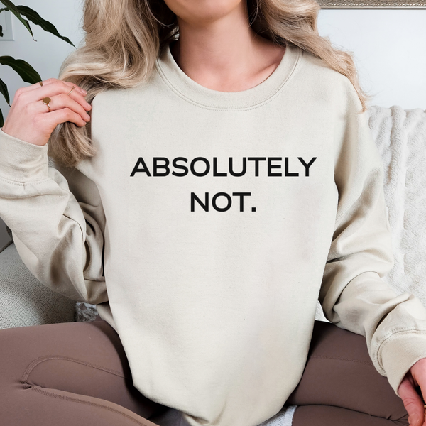 Person wearing a beige sweatshirt with 'ABSOLUTELY NOT.' text.
