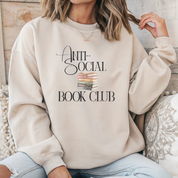 Person wearing a beige sweatshirt with 'Anti-Social Book Club' text and book graphic.