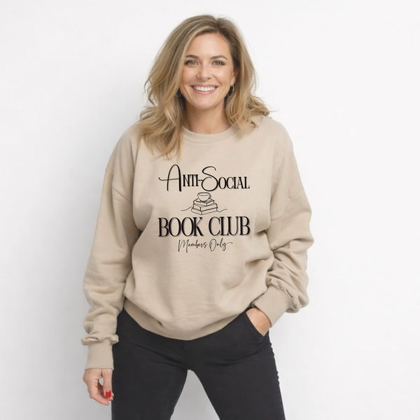 Woman wearing a beige sweatshirt with 'Anti-Social Book Club Members Only' text on a white background