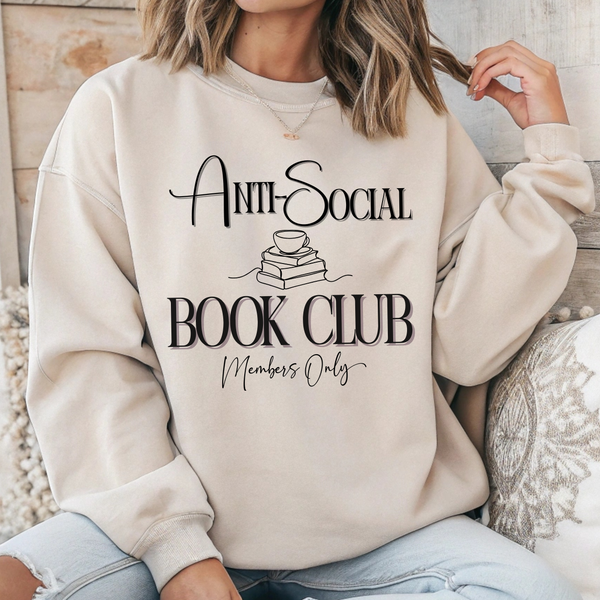 Person wearing a beige sweatshirt with 'Anti-Social Book Club Members Only' text.