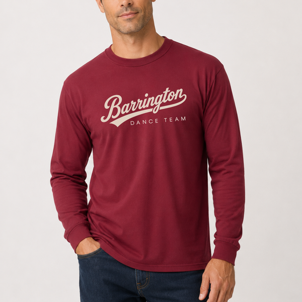 A man wearing a burgundy long-sleeve t-shirt with 'Barrington DANCE TEAM' printed in white script across the chest, paired with dark blue jeans, against a light gray studio background.