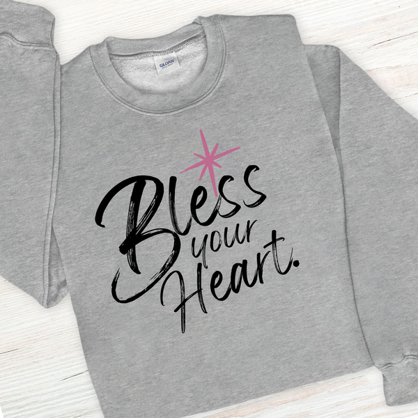 Gray sweatshirt with 'Bless your Heart' text and pink star design on a white background