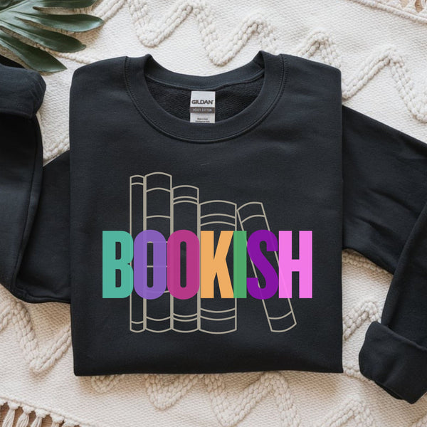 Black sweatshirt with 'BOOKISH' colorful graphic on a textured surface