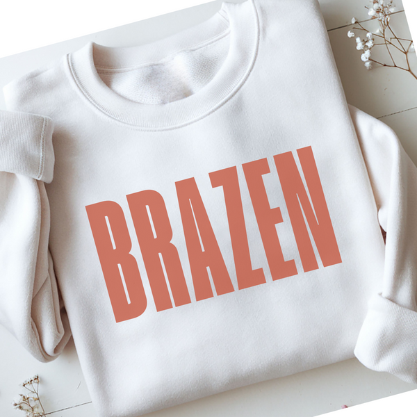 White sweatshirt with 'BRAZEN' printed in red on a light background