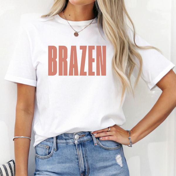 Person wearing a white t-shirt with 'BRAZEN' printed in red, standing against a plain background.