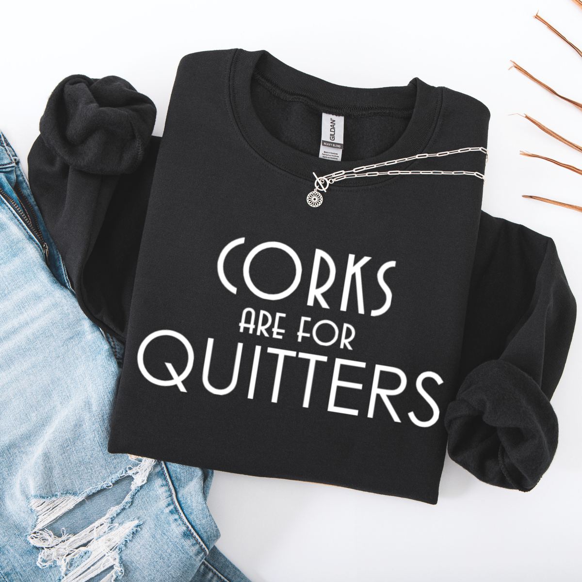 Black sweatshirt with 'Corks are for Quitters' text on a white background