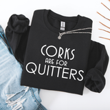 Black sweatshirt with 'Corks are for Quitters' text on a white background