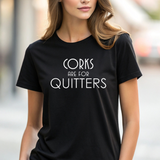 Person wearing a black t-shirt with 'Corks are for Quitters' text.