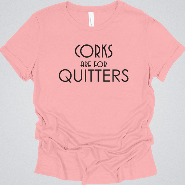 Pink t-shirt with 'Corks are for Quitters' text on a gray background