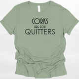 Sage green t-shirt with 'Corks are for Quitters' text on a white background
