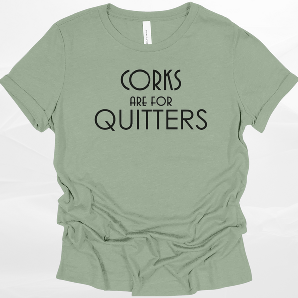 Sage green t-shirt with 'Corks are for Quitters' text on a white background