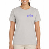 A woman wearing a light gray crewneck t-shirt with the letters 'DSDC' printed in purple on the left chest, paired with light beige pants, against a plain white background.