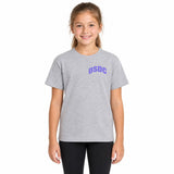 A young girl with light brown hair tied back, wearing a heather gray short-sleeve t-shirt with 'DSDC' printed in purple on the chest, paired with black pants, standing against a plain white background.