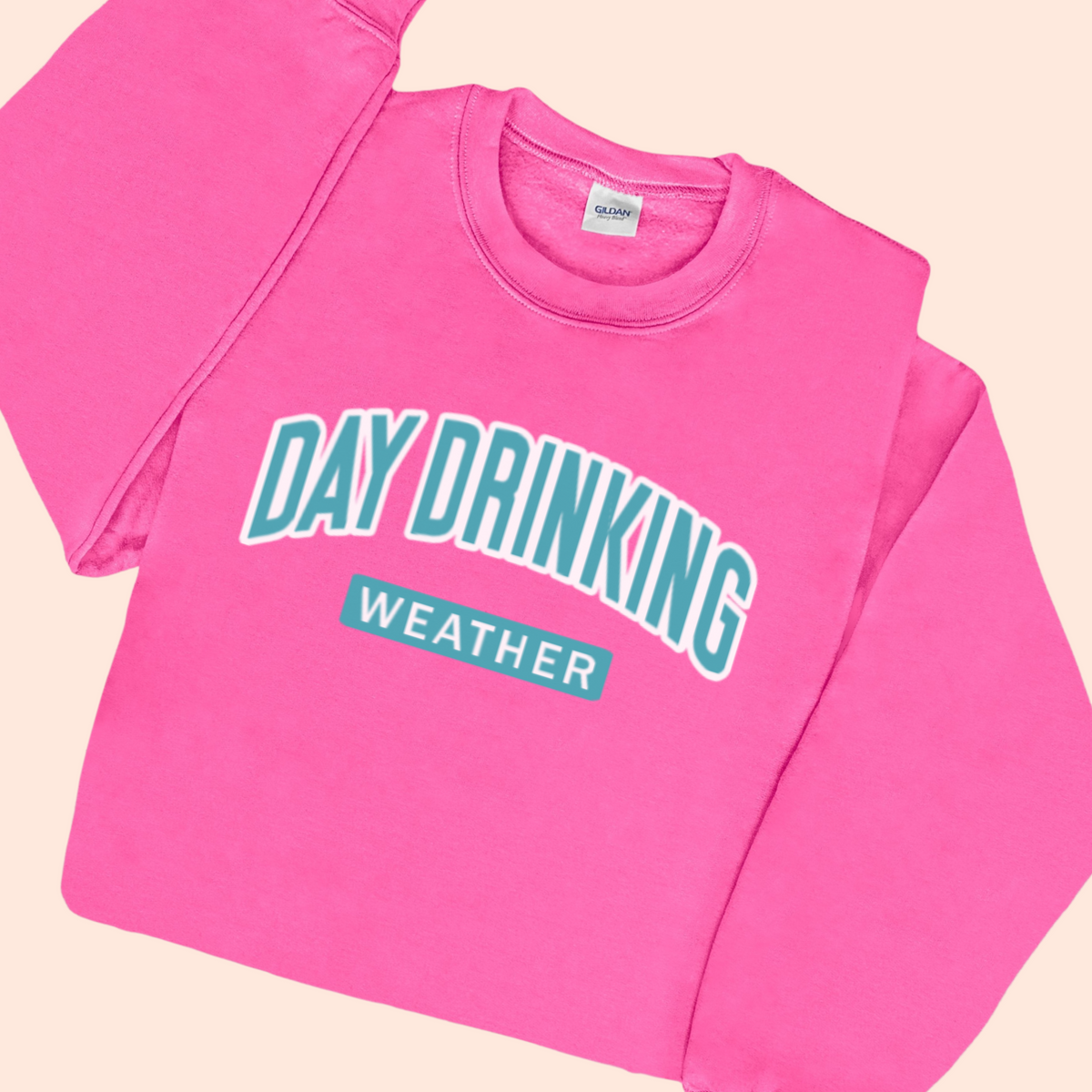 Bright Pink Sweatshirt with "Day Drinking Weather" in aqua blue font.