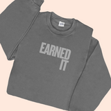 A gray sweatshirt with the words 