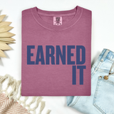 A berry colored Comfort Colors t-shirt that says 