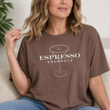 Woman wearing a brown t-shirt with 'Espresso Yourself' text and espresso cup graphic.
