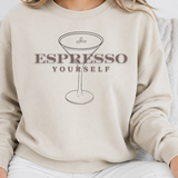 Beige sweatshirt with 'Espresso Yourself' graphic design on a person wearing it.
