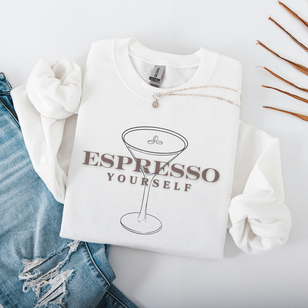 White sweatshirt with 'Espresso Yourself' text and espresso cup graphic on a light gray background.