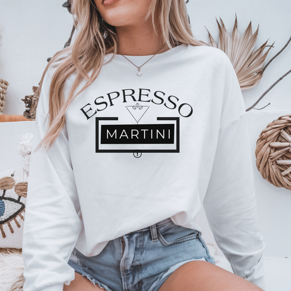 Person wearing a white sweatshirt with 'Espresso Martini' text design.
