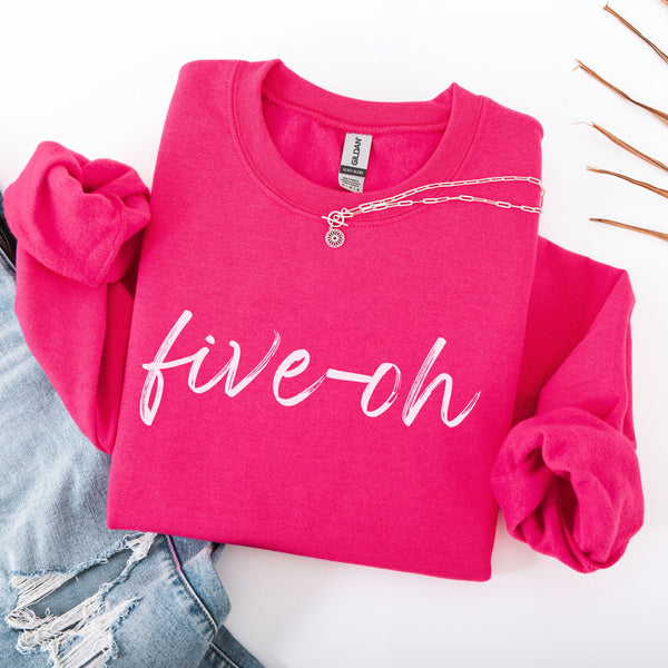 Pink sweatshirt with 'five-oh' text on a white background