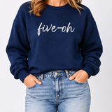 Navy blue sweatshirt with 'five-oh' text worn by a person on a plain background