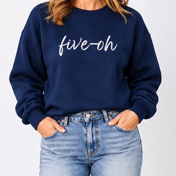 Navy blue sweatshirt with 'five-oh' text worn by a person on a plain background