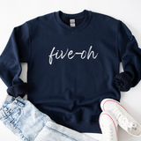 Navy blue sweatshirt with 'five-oh' text, paired with jeans and white sneakers on a light background