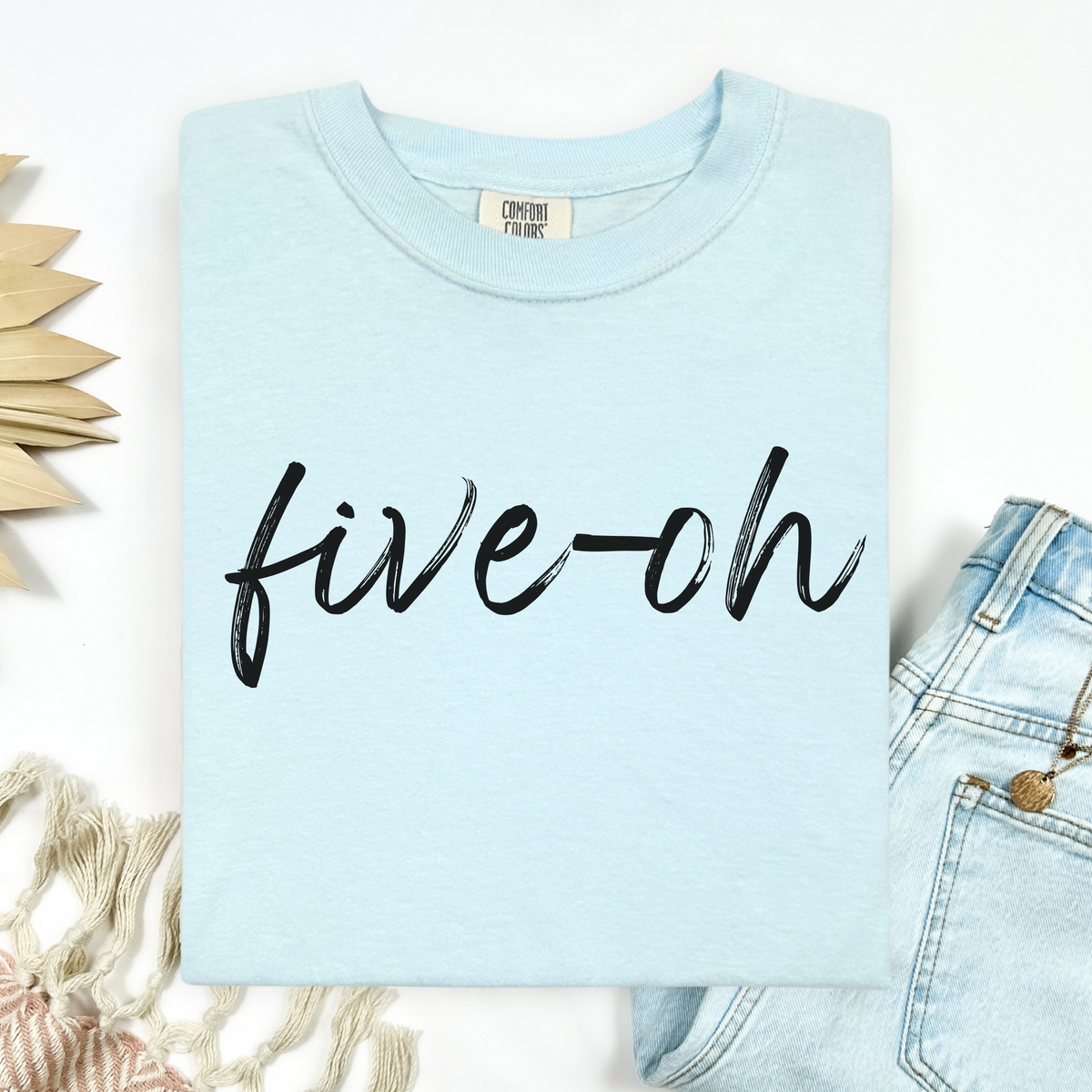 Light blue t-shirt with 'five-oh' text on a white background