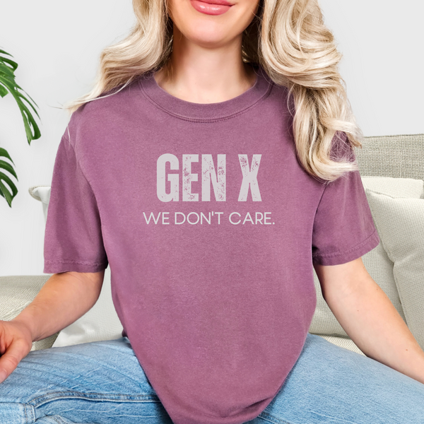 Person wearing a purple berry t-shirt with 'GEN X WE DON'T CARE' text.
