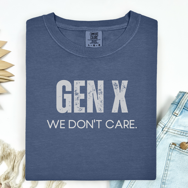 Blue t-shirt with 'GEN X WE DON'T CARE' text on a light background