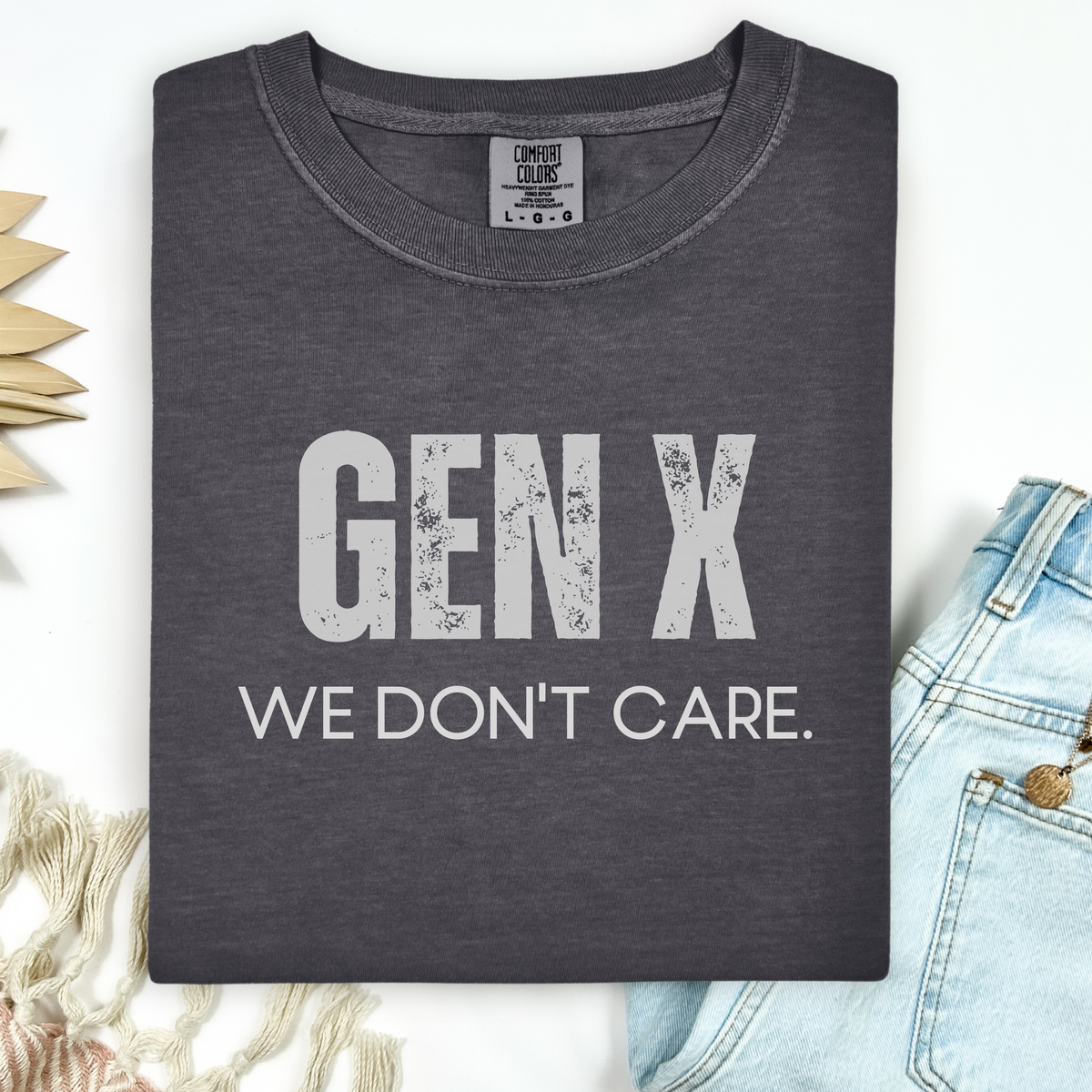 Dark gray t-shirt with 'GEN X WE DON'T CARE' text on a light background