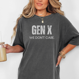 Person wearing a gray t-shirt with 'GEN X WE DON'T CARE' text, holding a drink.
