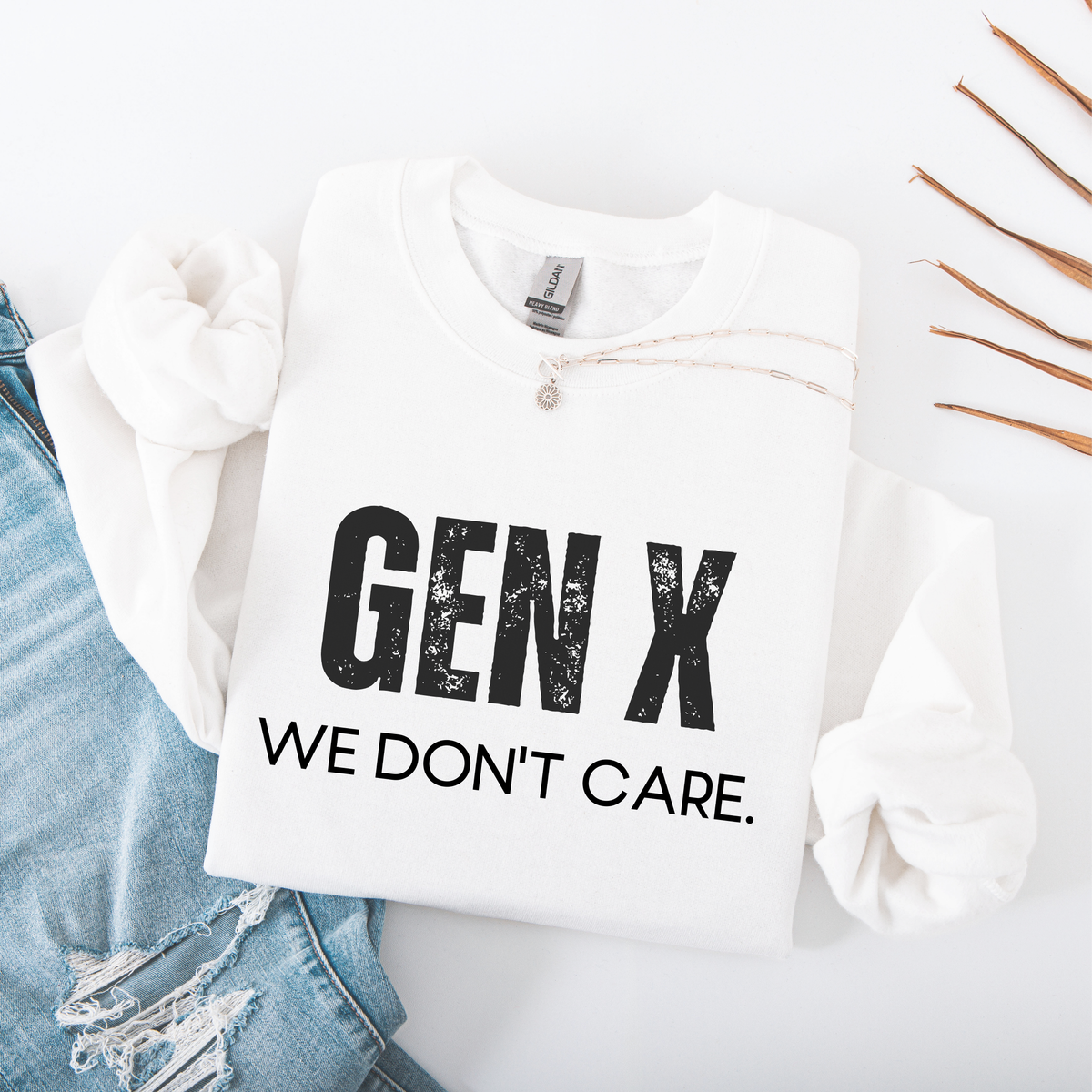 White sweatshirt with 'GEN X WE DON'T CARE' text on a white background