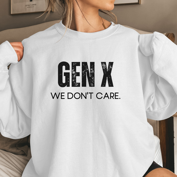 White sweatshirt with 'GEN X WE DON'T CARE' text worn by a person.