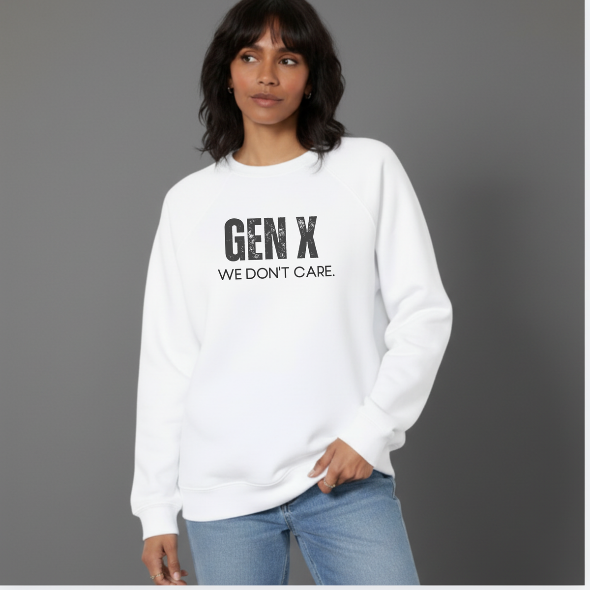 A woman wearing a white sweatshirt with 'GEN X WE DON'T CARE' text on a gray background