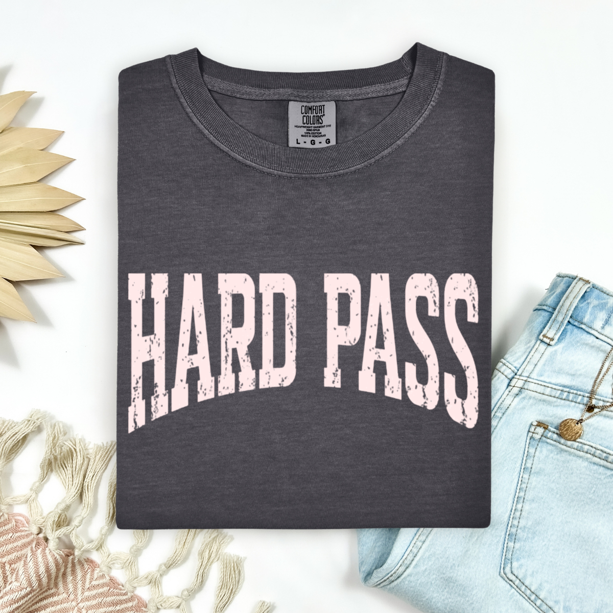 Dark gray t-shirt with 'HARD PASS' text on a light background