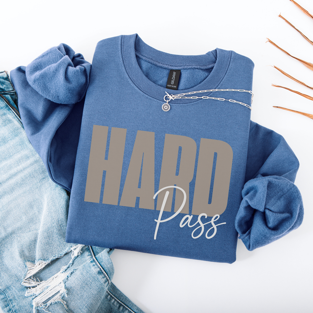Blue sweatshirt with 'HARD Pass' text on a white background