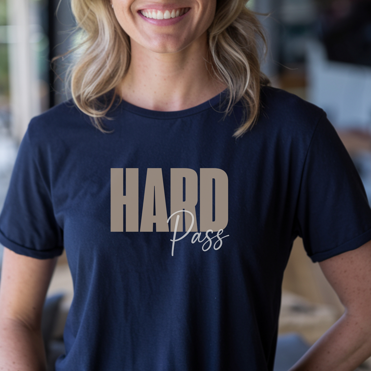 Person wearing a navy blue t-shirt with 'HARD Pass' text.