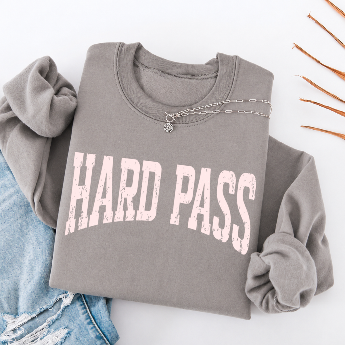 Gray sweatshirt with 'HARD PASS' text on a white background