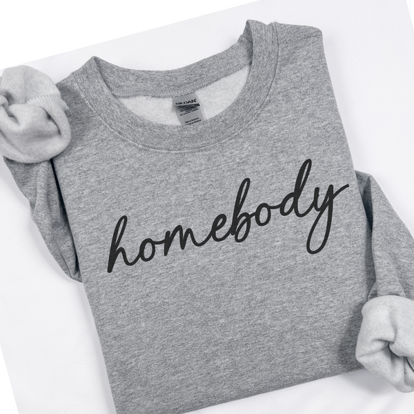 Gray sweatshirt with 'homebody' text on a white background