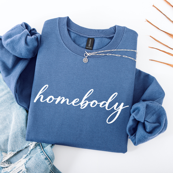 Blue sweatshirt with 'homebody' text on a white background