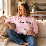 A woman in a pink sweatshirt that says 